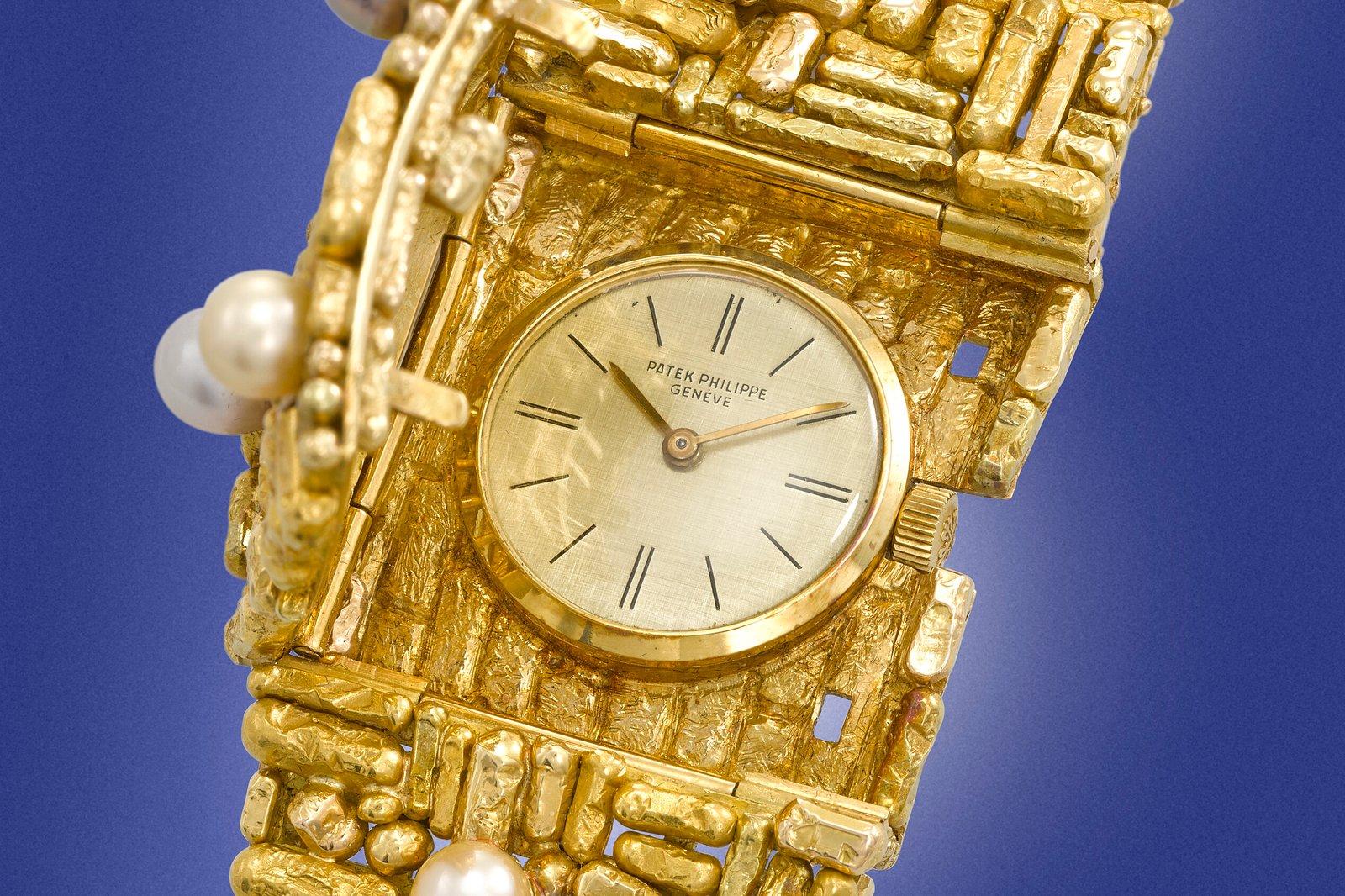 Patek Philippe, ref. 3295, 18k gold and cultured pearl-set bracelet watch. Designed by Gilbert Albert and from 1961.