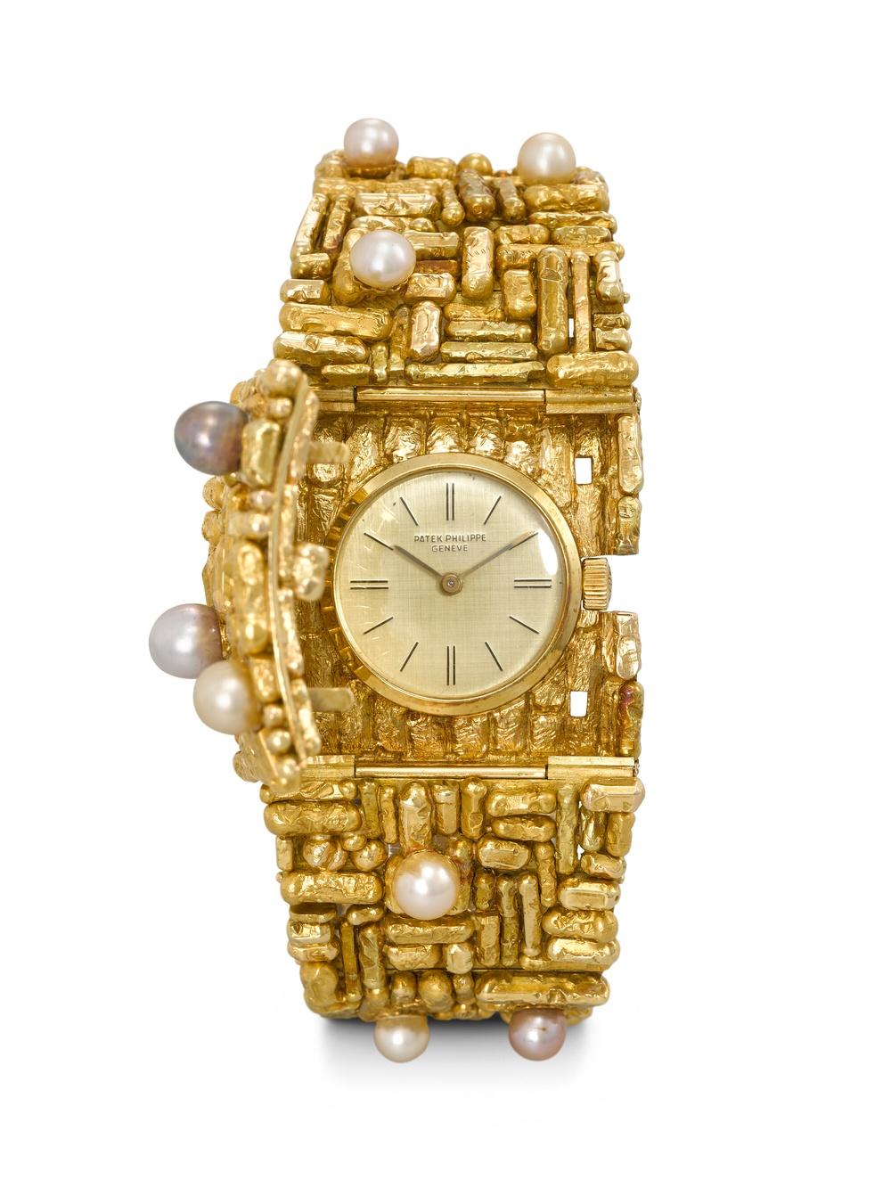 Patek Philippe, ref. 3295, 18k gold and cultured pearl-set bracelet watch. Designed by Gilbert Albert and from 1961.
