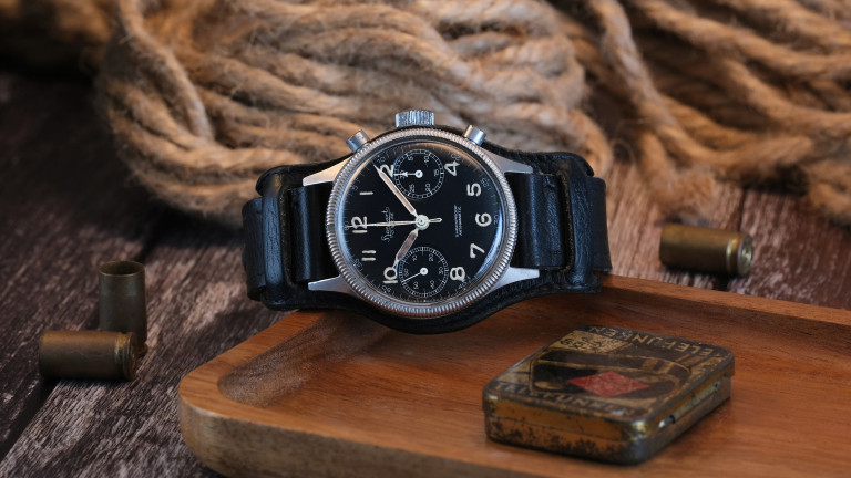 This late-1950s Hanhart 417 ES is thought to be one of around 500 stainless steel examples produced. Sold to the civilian market rather than issued to the German Air Force, it remains complete with its original Bund strap, paperwork and 1961 sales receipt, offering a remarkable snapshot of Hanhart's post-war history.